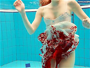 torrid grind red-haired swimming in the pool